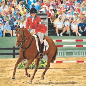 woman riding horse before a crowd equestrian competition