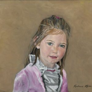 portrait of girl in pink coat in 3/4 view