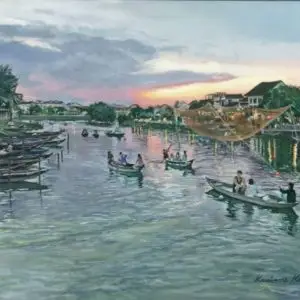 Vietnam river scene with boats on water in foreground and village in background